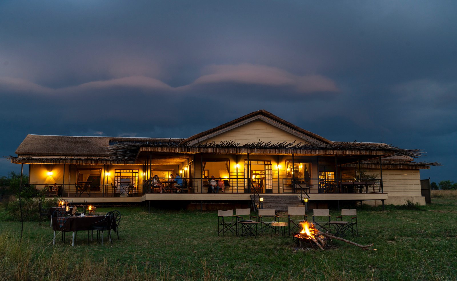 Travelers on top of a safari vehicle in Tanzania